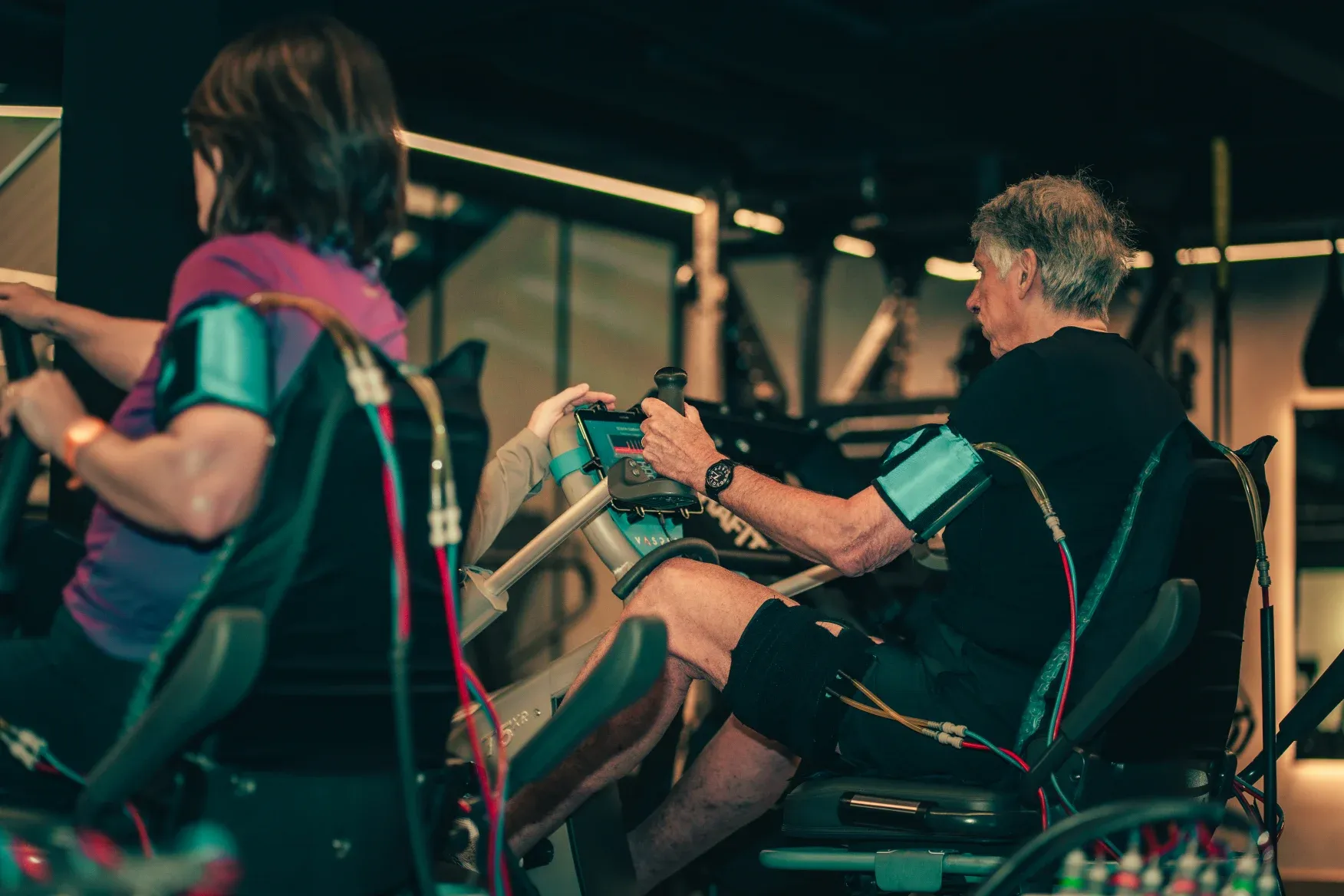 Members using the Vasper system with compression cuffs during a training session at The FIT Partnership in Esher, Surrey